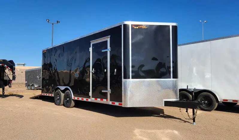 Black enclosed cargo trailer with door open.