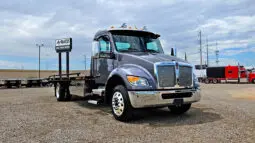 Gray tow truck with chrome accents.