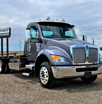 Gray tow truck with chrome accents.