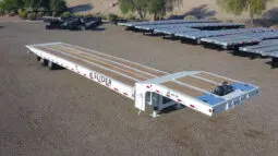 White XL Slider trailer with wooden deck.