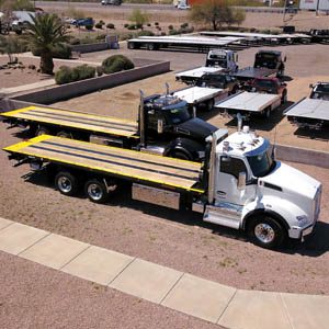 A heavy-duty carrier is a type of tow truck that is specifically designed to transport heavy vehicles such as buses, RVs, and construction equipment. These carriers are built with heavy-duty steel and are equipped with hydraulic systems that allow them to lift and transport heavy loads.