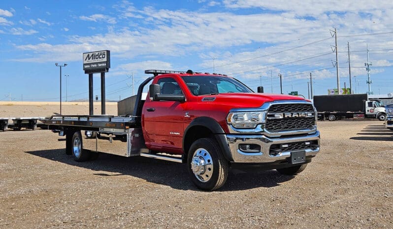 Red Ram tow truck with black flatbed.