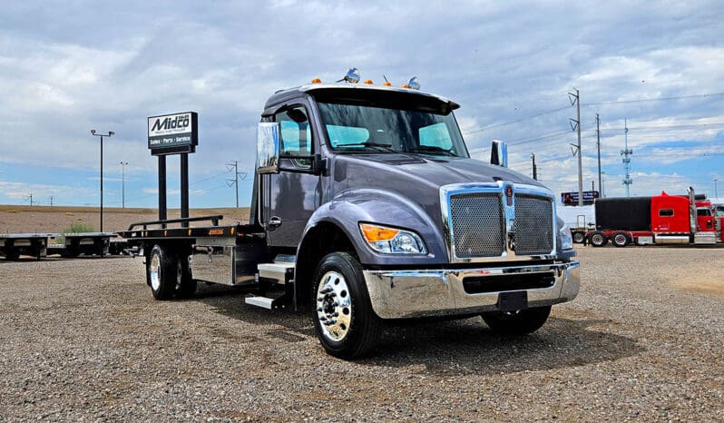 Gray tow truck with chrome accents.