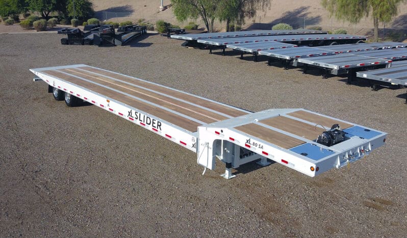 White XL Slider trailer with wooden deck.