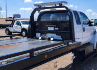 2023 Ford F650 used Jerrdan rollback tow truck - 16 - rear view of cab, headboard, lightbar, winch