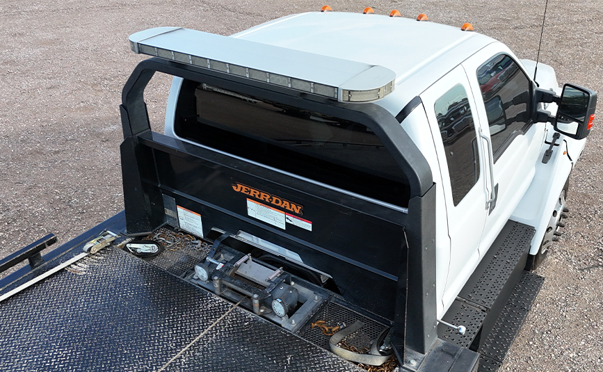 Ford F560 rollback tow truck for sale - Jerr-Dan - 15 - aerial view cab, lightbar, headboard, winch