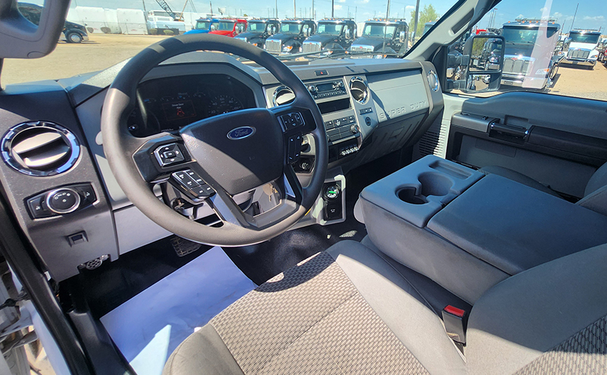 Ford F560 rollback tow truck for sale - Jerr-Dan - 22 - front seat, stearing wheel, dashboard