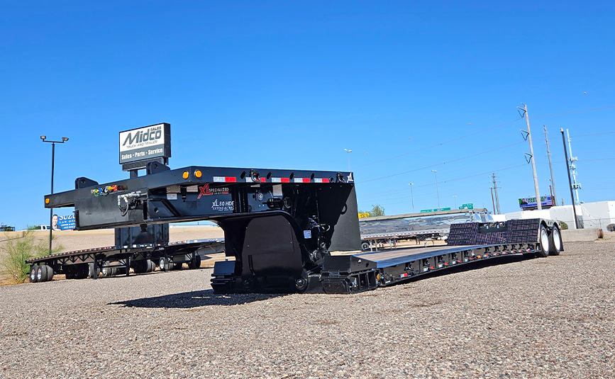 2026 used xl specialized xl80 HDGE extendable double drop trailer -02 - low angle front view, gooseneck
