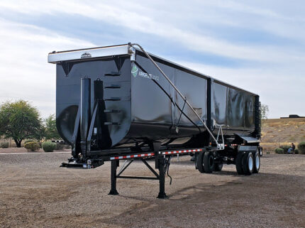 armor light high side demo end dump trailer - 01 - front, side angled view
