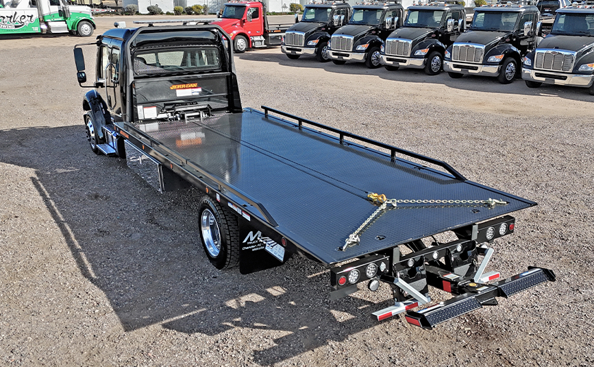 22026 freightliner m2 106 plus jerr-dan rollback tow truck - 05 - rear view, driver side, under lift, rollback flatbed, chain bridle