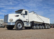 2022 peterbilt 567 simple 18 dump truck - 02 - driver side view