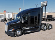 2022 kenworth T680 black sleeper cab truck - 01 - driver side view