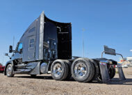 2022 kenworth T680 black sleeper cab truck - 05 - rear view, driver side
