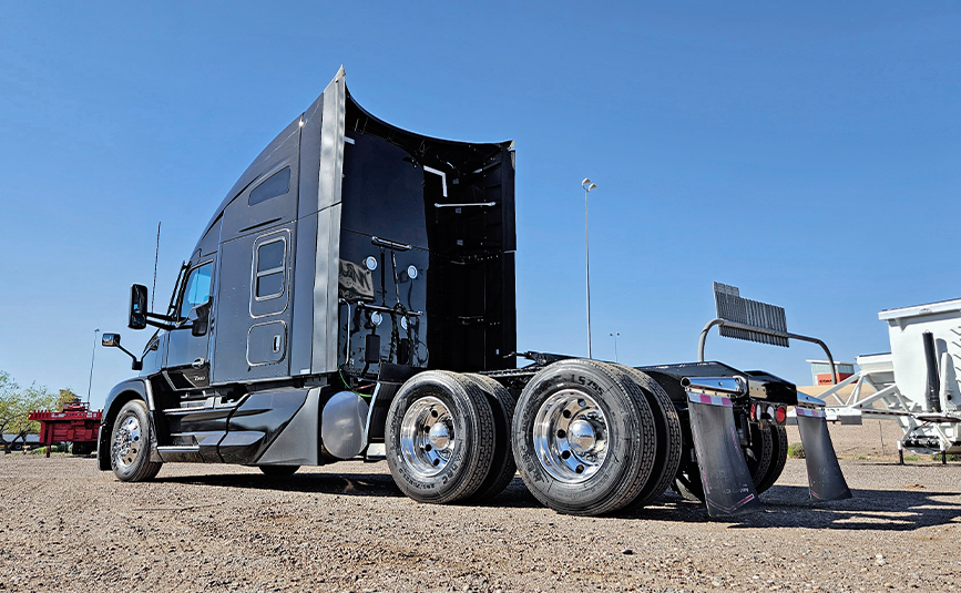 2022 kenworth T680 black sleeper cab truck - 05 - rear view, driver side