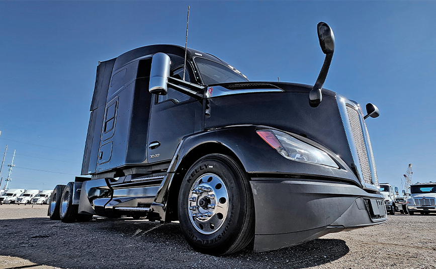 2022 kenworth T680 black sleeper cab truck - 07 - driver side front tire and wheel