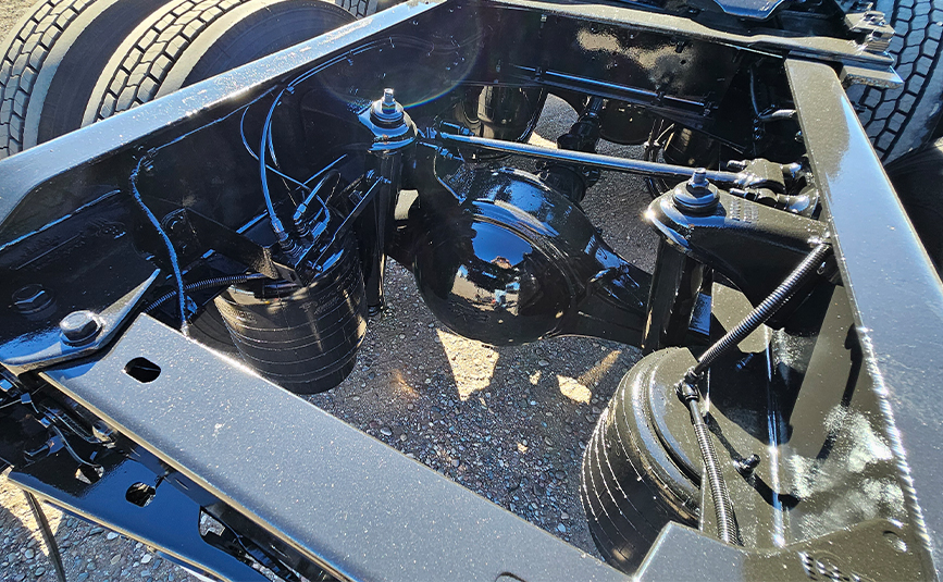 2022 kenworth T680 black sleeper cab truck - 17 - suspension air bag