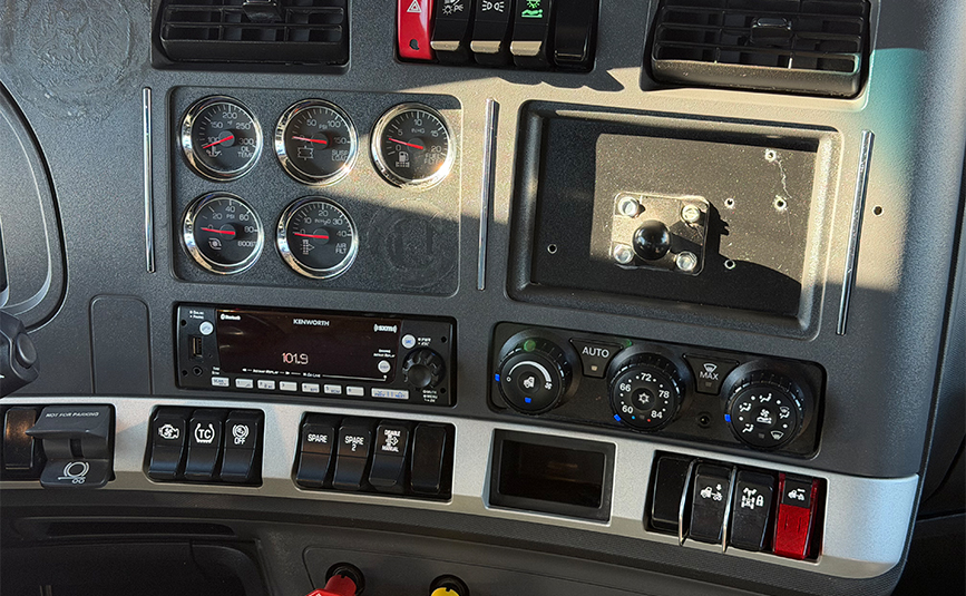 2022 kenworth T680 black sleeper cab truck - 24 - dashboard buttons radio