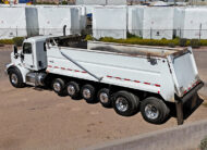 2022 peterbilt simple 18 dump truck - 03 - side rear angled view