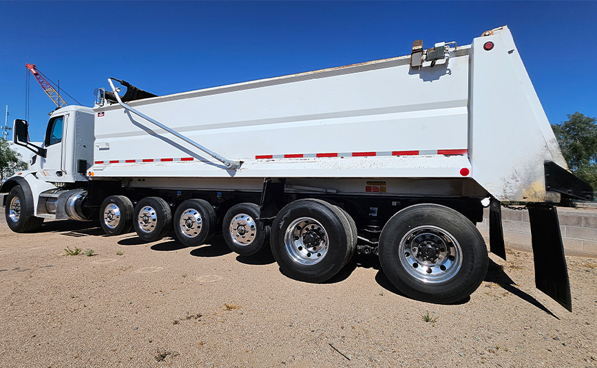 2022 peterbilt simple 18 dump truck - 03 - side rear angled view