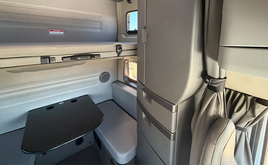 2024 used Volvo VNL64T860 sleeper cab truck - 19 - sleeper cab storage cabinet, top bunk, table