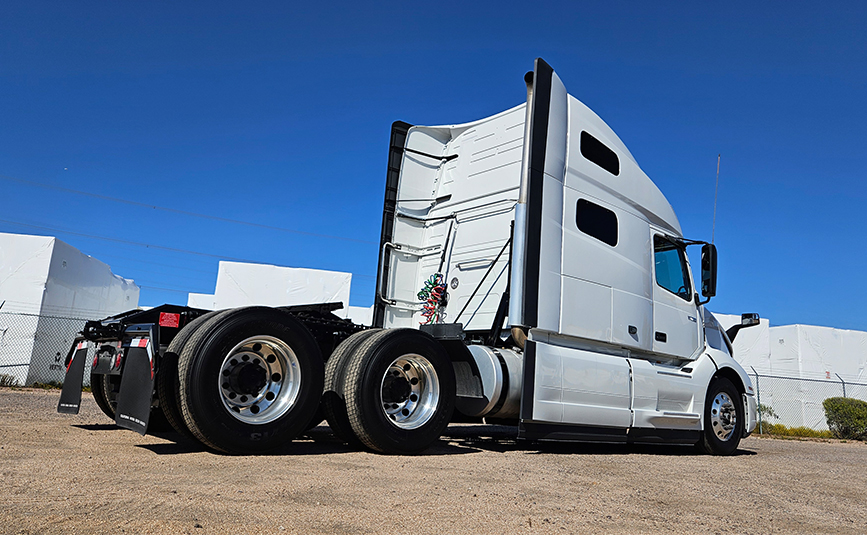 2025 volvo VNL64T760 sleeper cab truck - 02 - passenger side rear angle, wheels tires