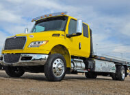 2027 international mv607 jerr-dan rollback yellow tow truck - 07 - front, driver side