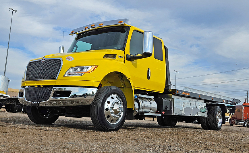 2027 international mv607 jerr-dan rollback yellow tow truck - 07 - front, driver side